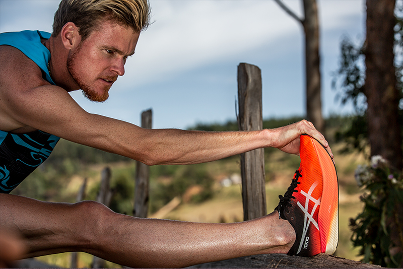 man stretching pre run