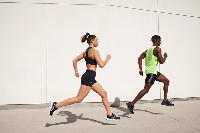 Two people running outside